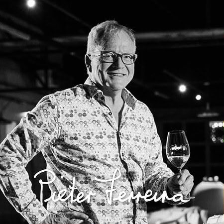 Pieter Ferreira Showcasing A Glass Of Stellenbosch Wine.