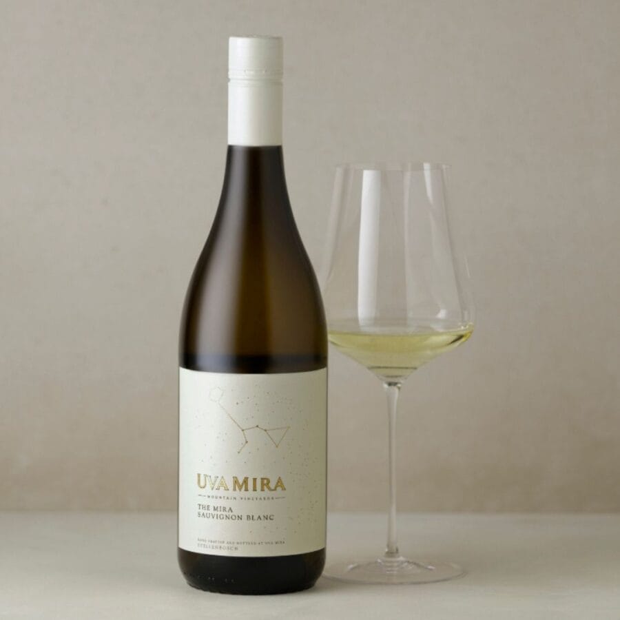 Uva Mira The Mira Sauvignon Blanc 2025 Stellenbosch white wine bottle next to wine glass with wine against a white backdrop