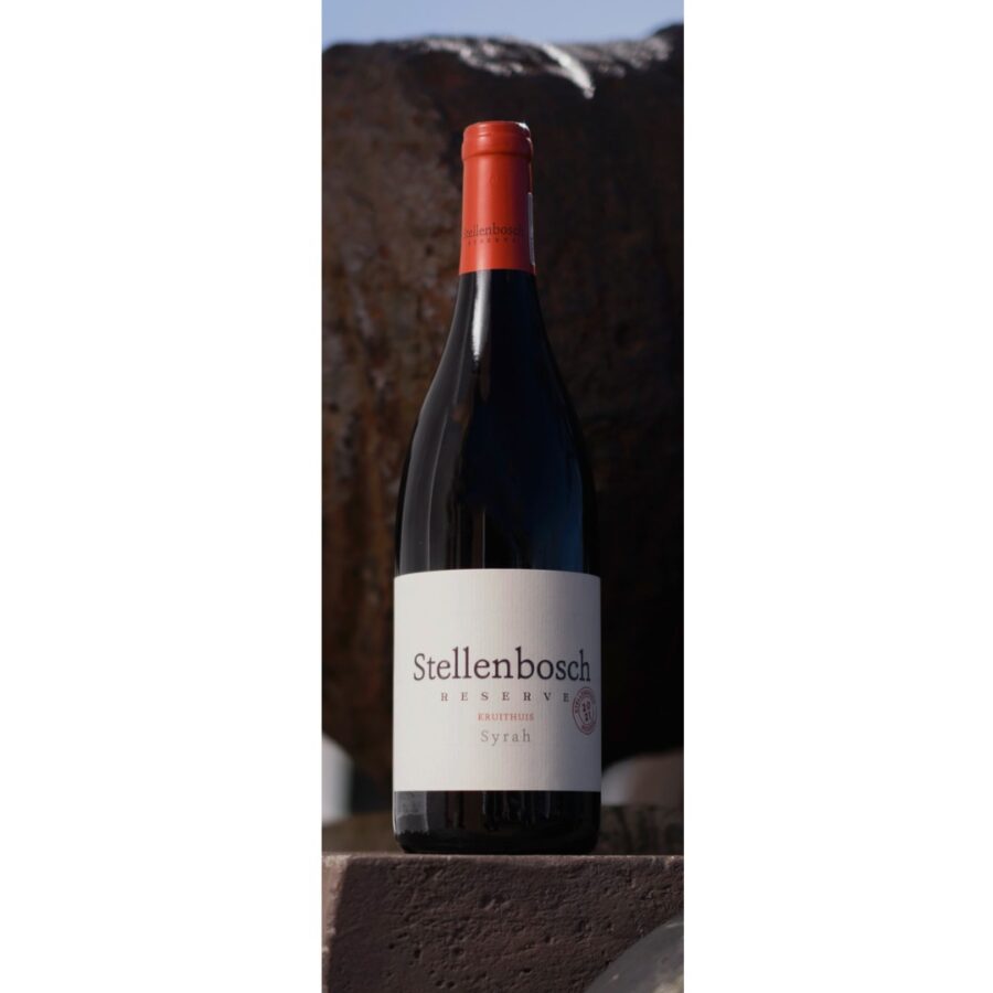 Stellenbosch Reserve Syrah bottle against a rustic backdrop.